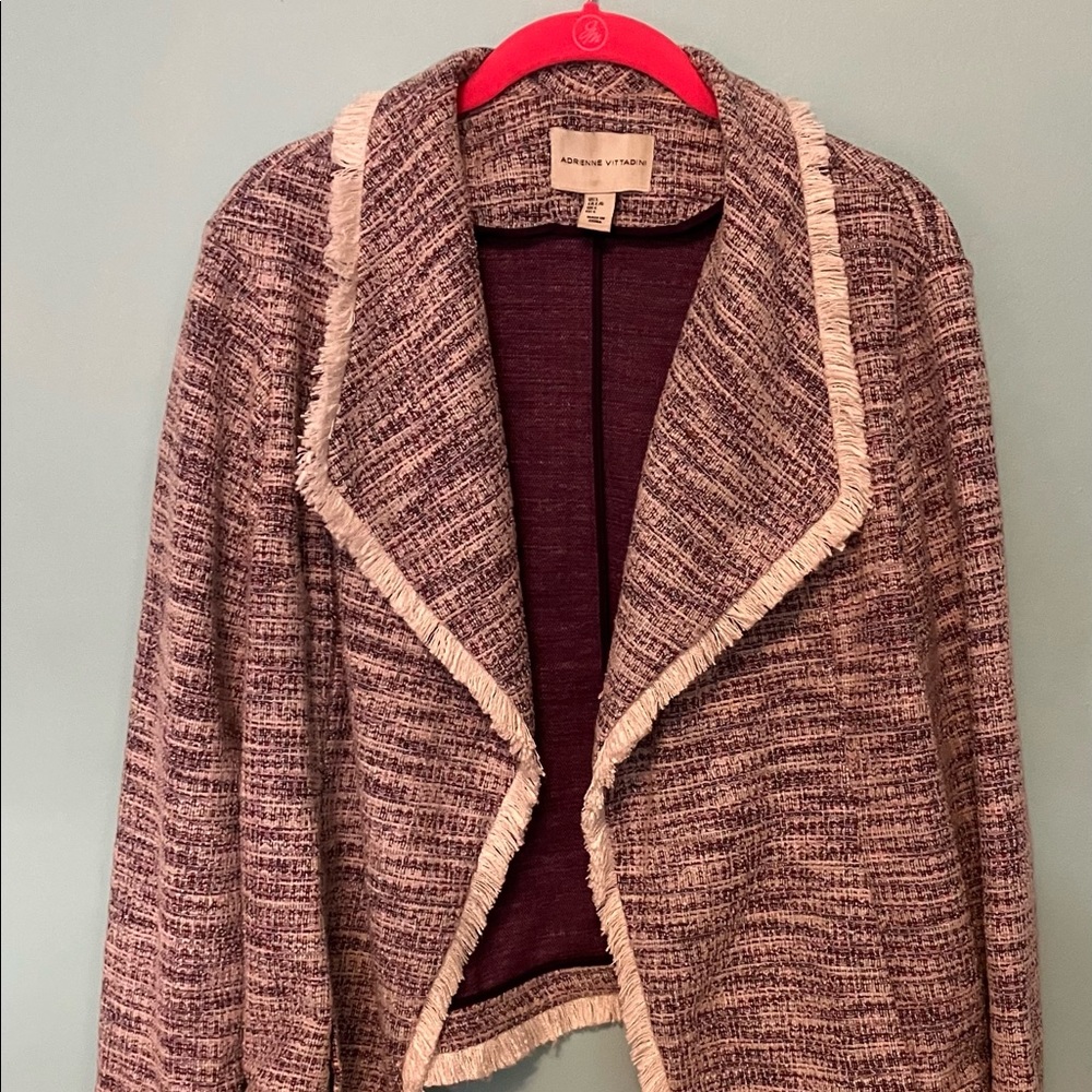 Fun fringed blazer, great to pair with a dress, dress pants, or jeans!